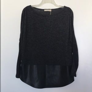 Black long sleeve top with faux leather panel